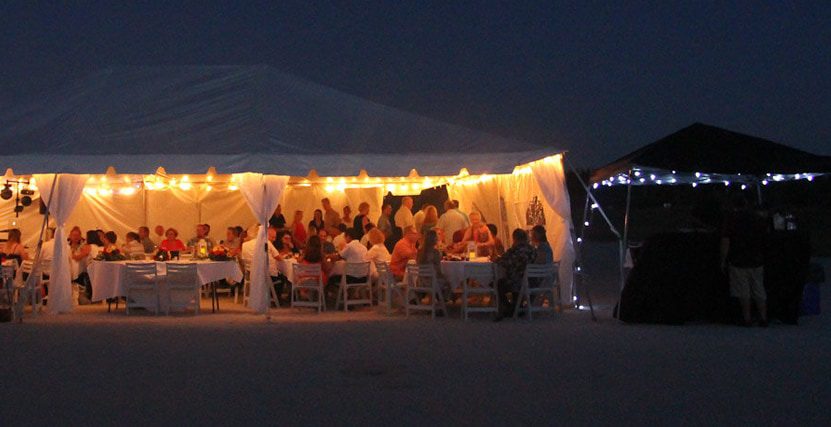 Sand Key Beach Wedding Reception Tent at Night with people