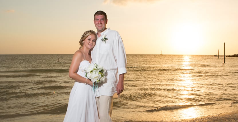 Bride and Groom Smile during Sunset