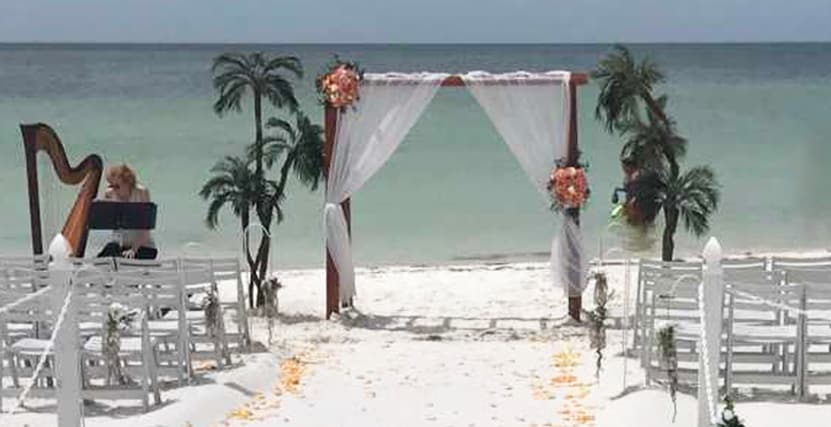Sand Key Beach Ceremony setup in Clearwater, FL with Harp Player