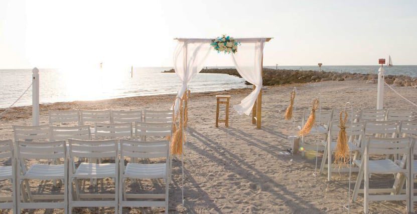 Bamboo Arch setup with chairs at the Jetty on Sand Key Beach